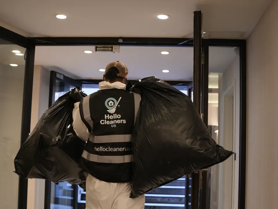 Hello Cleaners crew in branded vests at work on a job