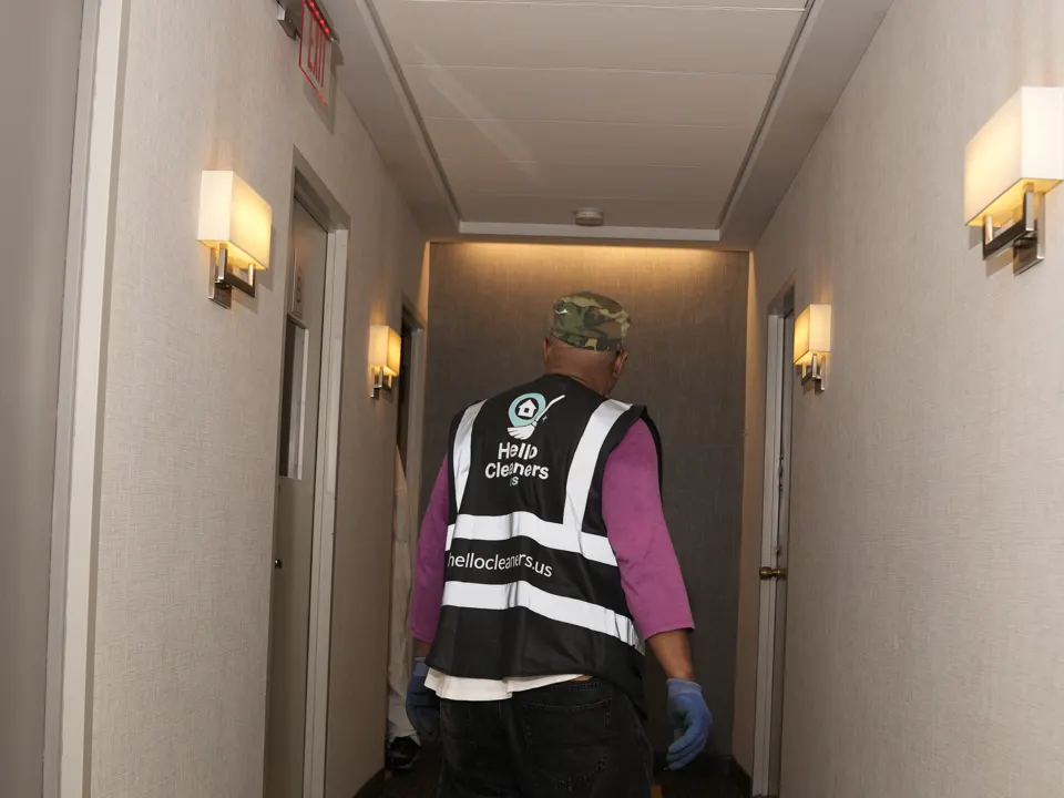 Hello Cleaners crew in branded vests at work on a job
