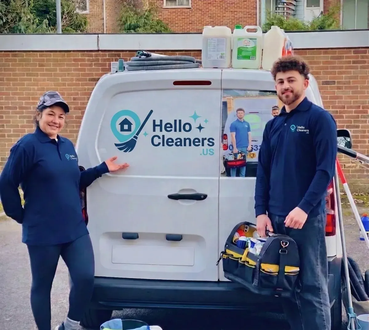 Hello Cleaners team loading supplies into a van