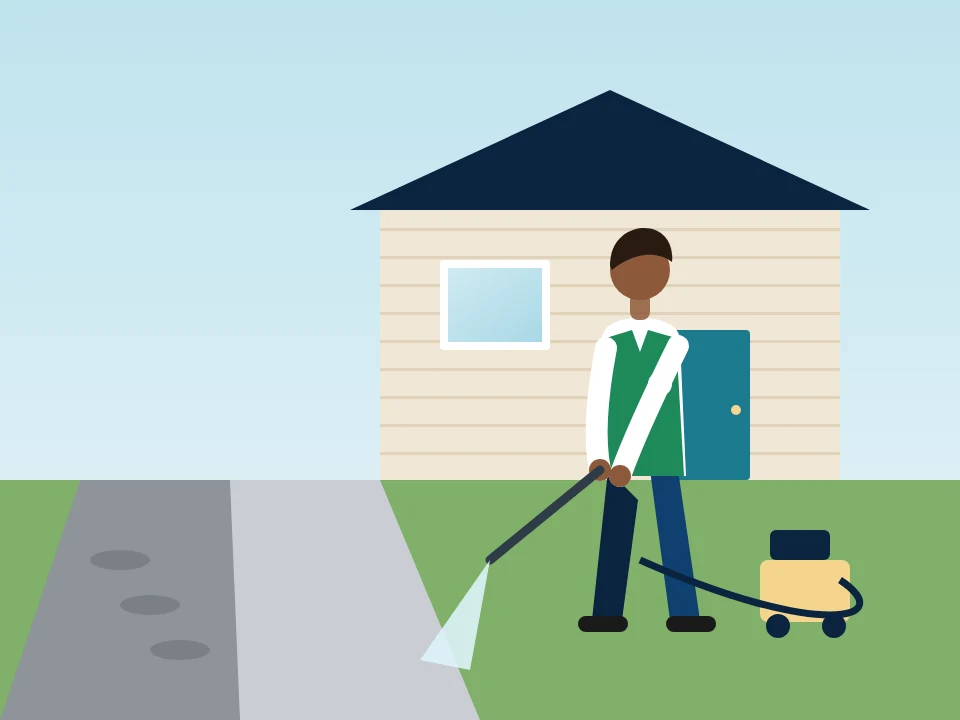 Illustration of pressure washing a driveway in front of a house in Concourse & Highbridge, New York