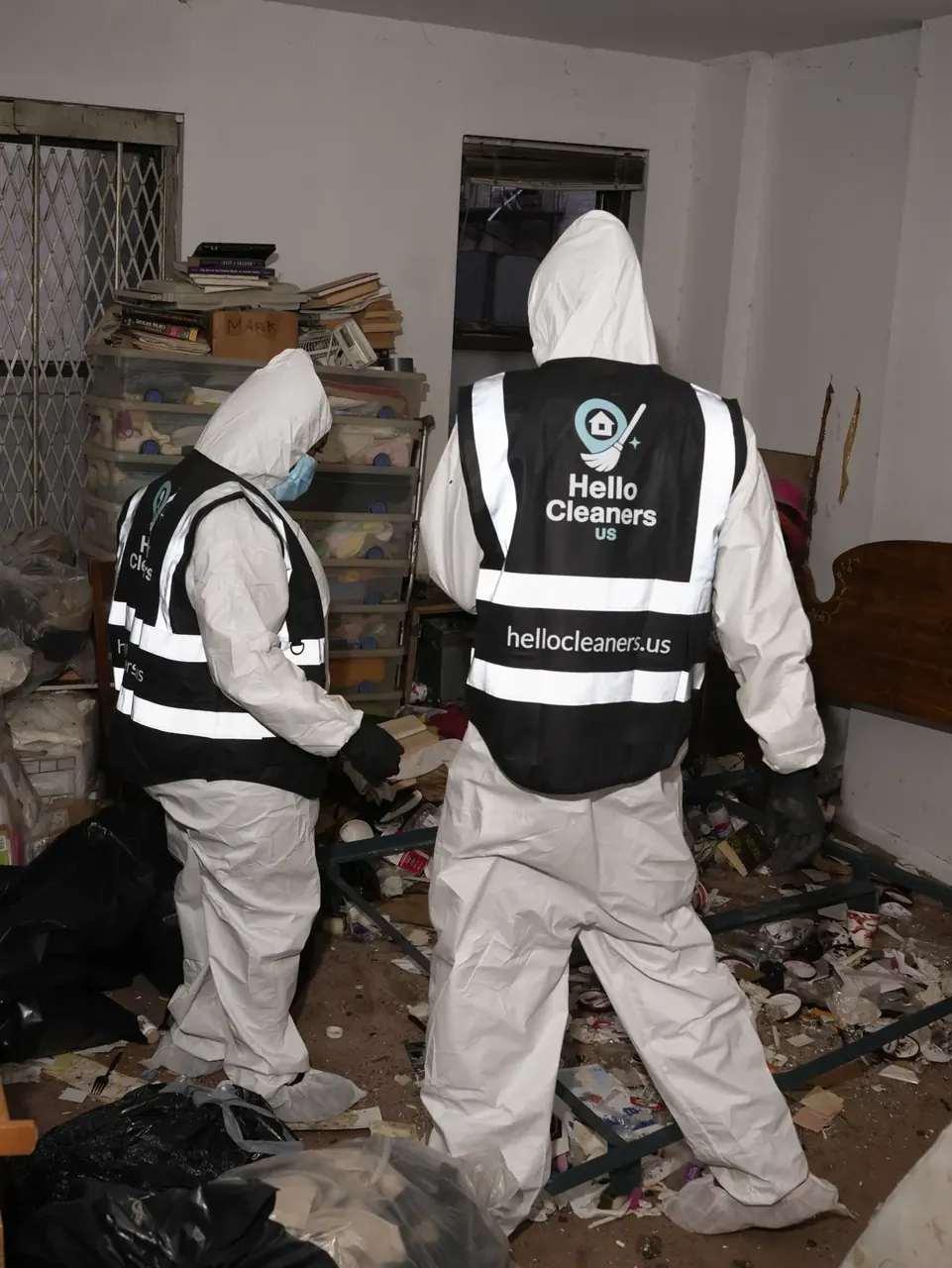 Hello Cleaners crew clearing a bedroom