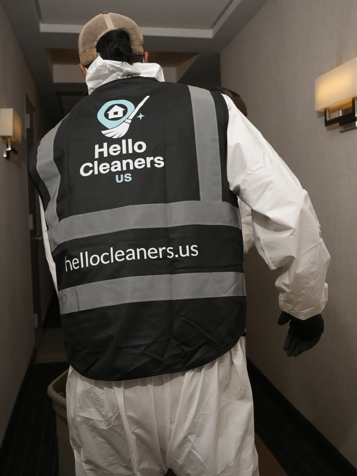 Hello Cleaners crew member in a branded vest