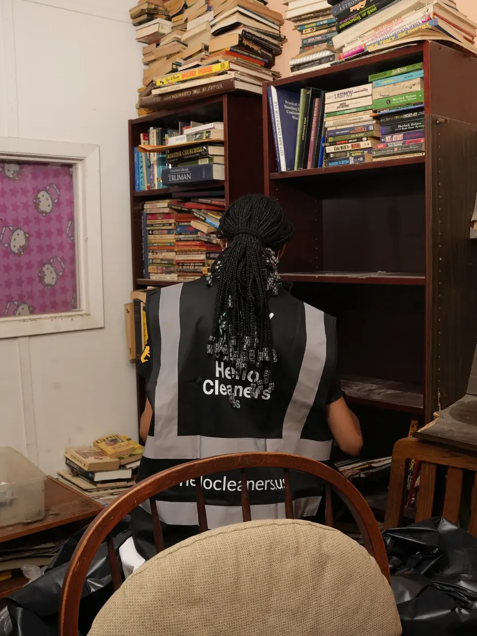 Hello Cleaners organizer at a bookcase