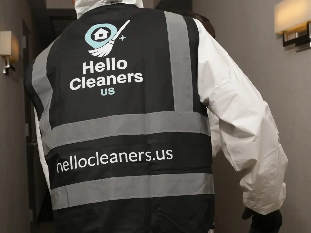 Hello Cleaners crew in branded hi-vis vests and protective suits during a heavy-duty clean-out