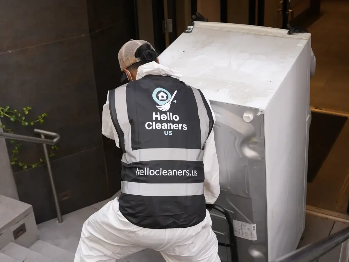 Hello Cleaners crew in branded hi-vis vests and protective suits during a heavy-duty clean-out