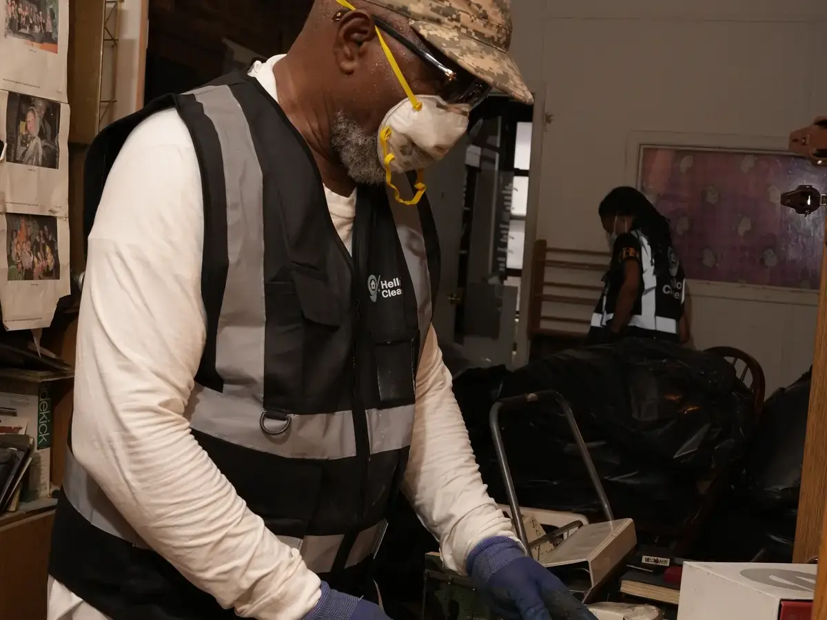 Hello Cleaners crew in branded hi-vis vests and protective suits during a heavy-duty clean-out