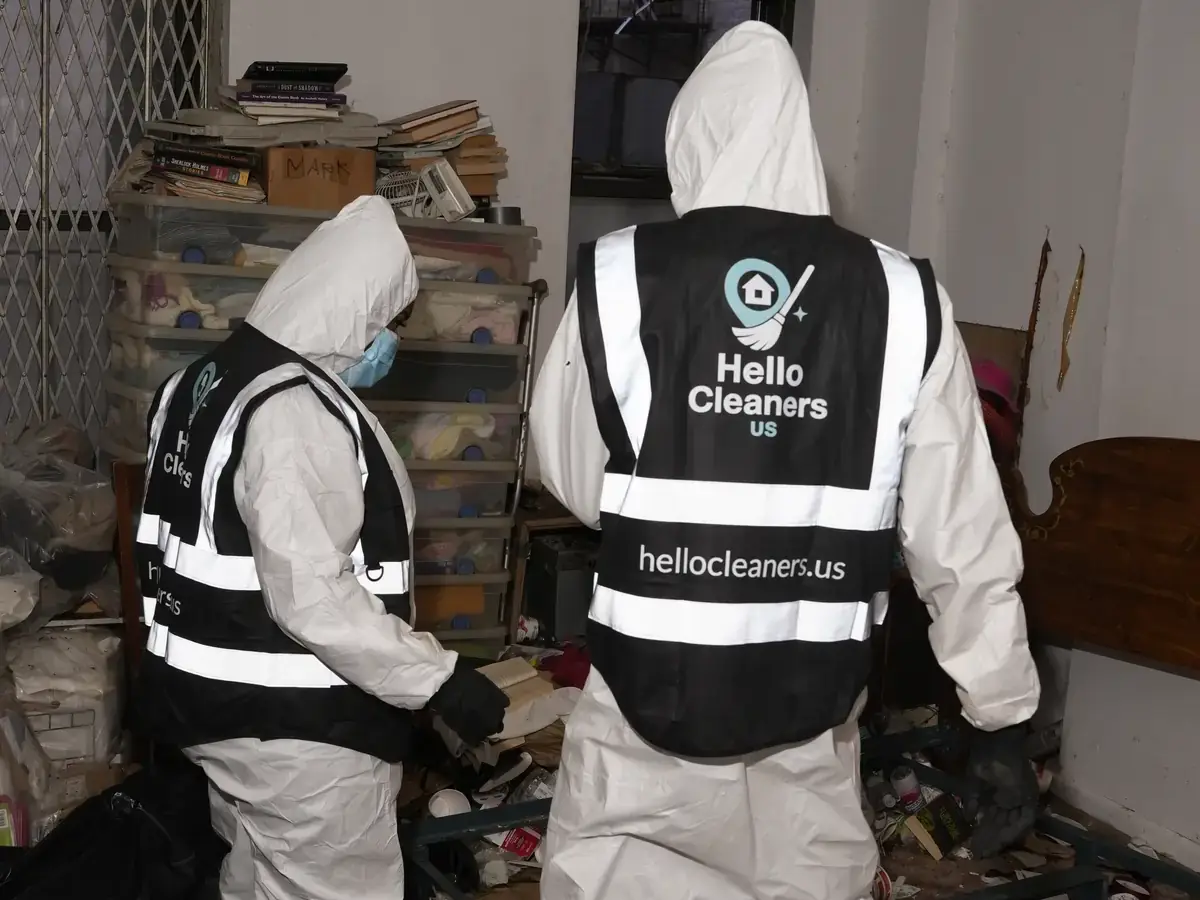 Hello Cleaners crew in branded hi-vis vests and protective suits during a heavy-duty clean-out