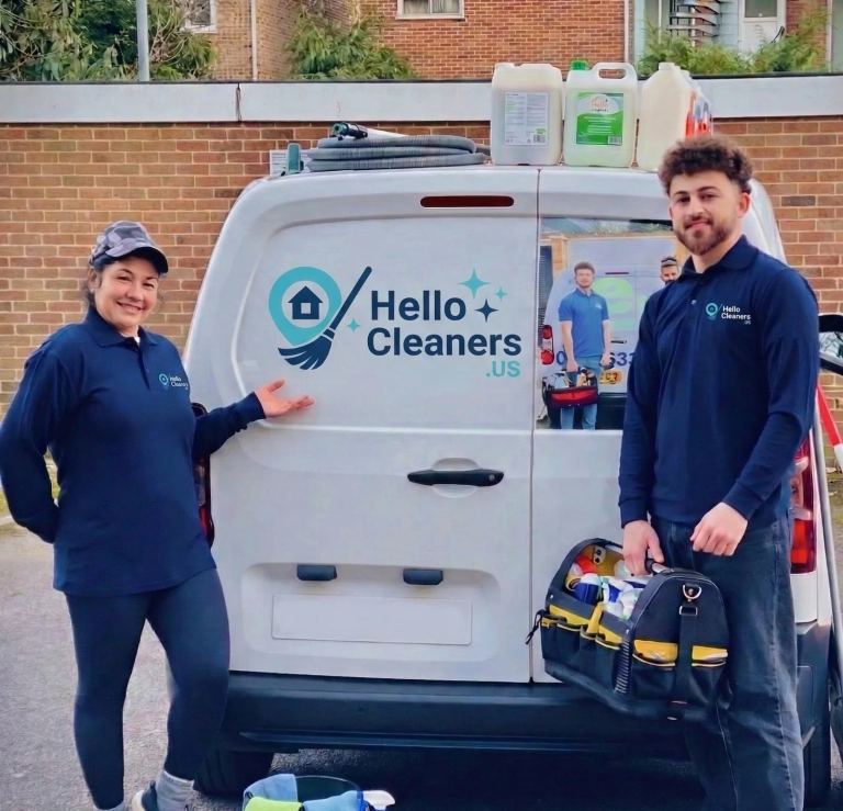 Two Hello Cleaners team members beside a branded Hello Cleaners service van with their cleaning kit